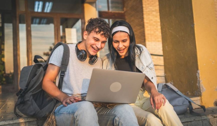 Student watching film on laptop