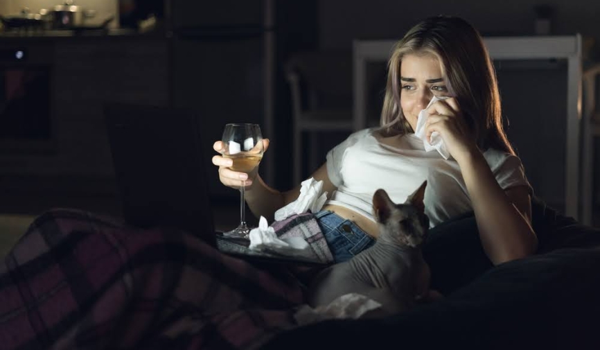 A girl crying while watching a movie | Breakup movies